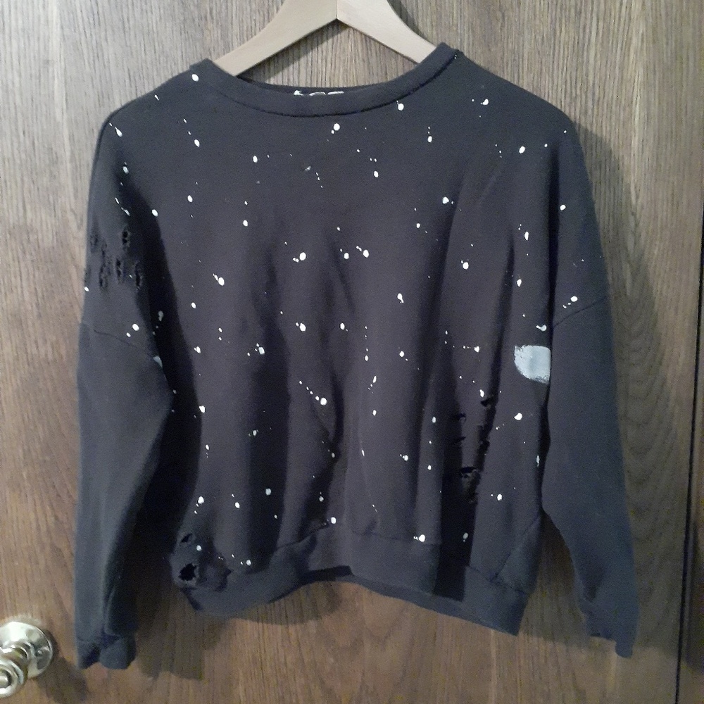 Paint splattered sweatshirt.